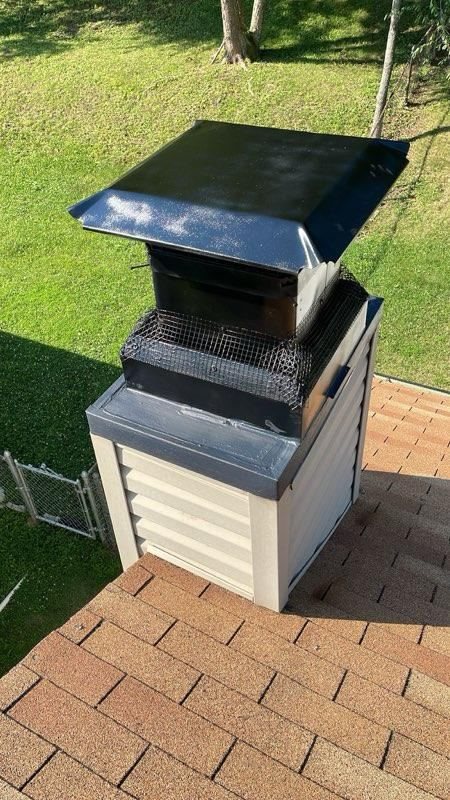 A chase cover and cap on a sided chimney chase