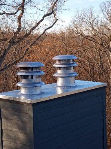 New stainless steel chimney caps ready to install